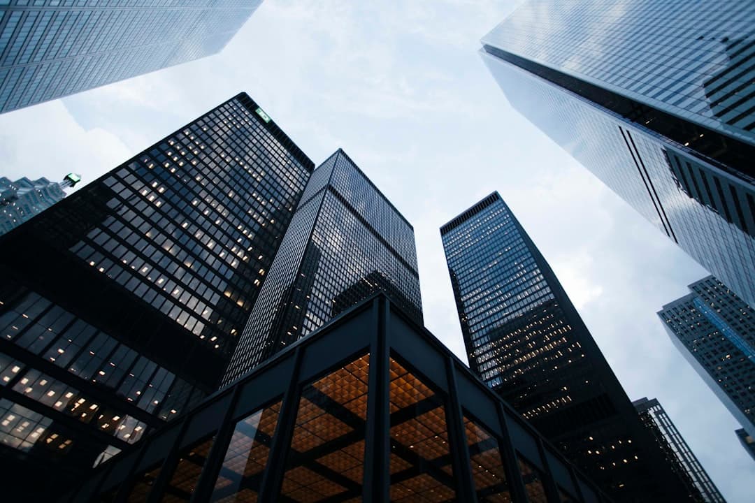 Modern commercial building with glass facade at sunset