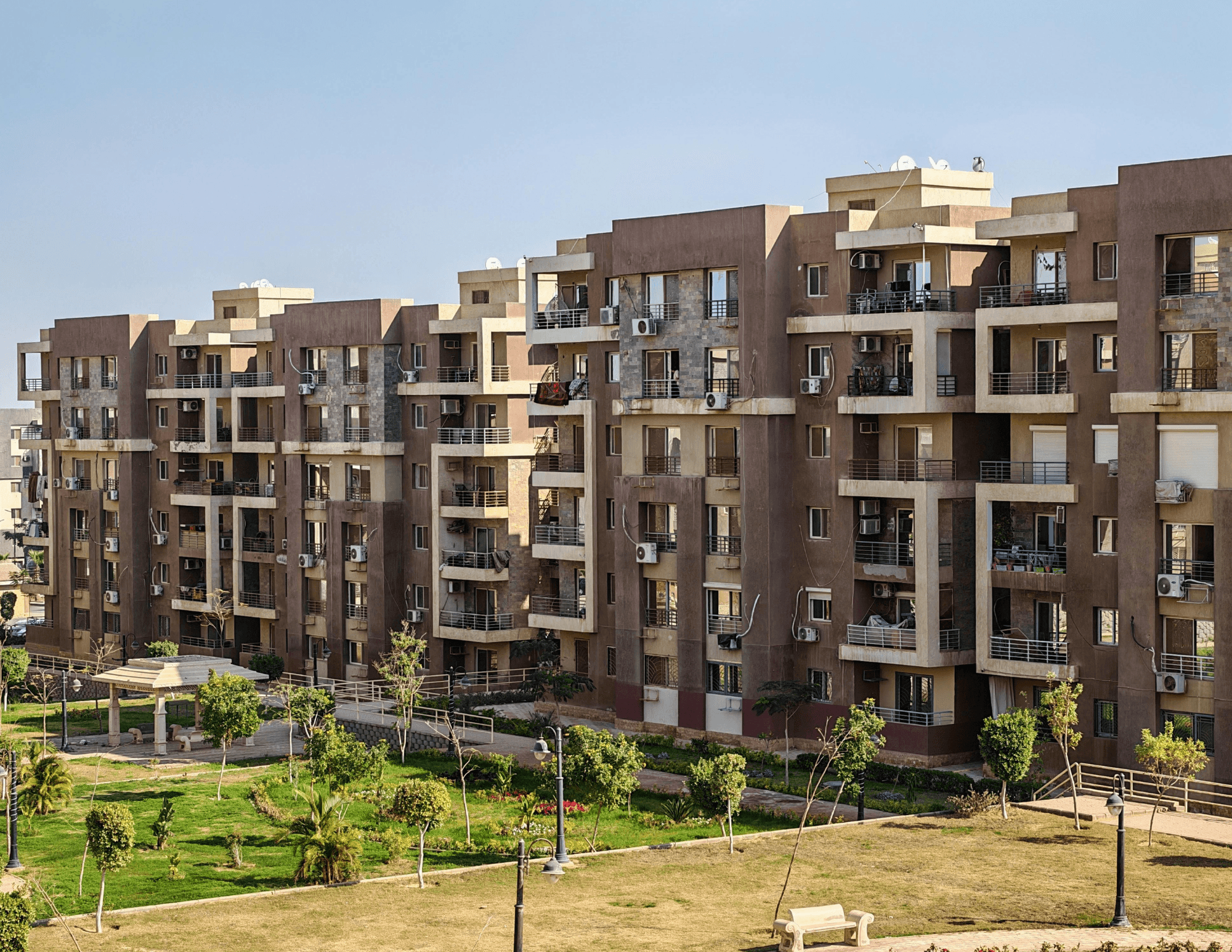 Apartment buildings beside open land